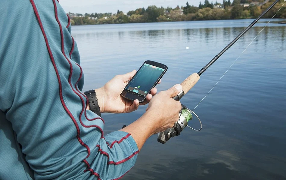 Man Using Portable Fish Finder